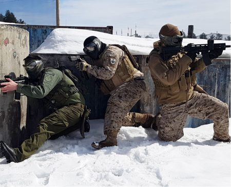 3 men in full tactical gear playing paintball in winter using a variety of markers and G.I. Sportz Frostbite Paintballs