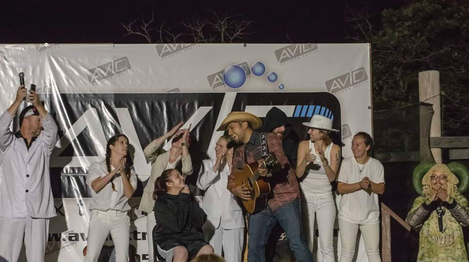 Singing and Playing music on stage at night at October Game in Oklahoma.